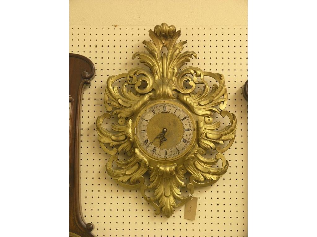 Appraisal: A rococo-style moulded gilt wall clock with silvered chapter ring