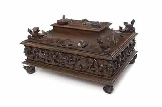 Appraisal: A Carved Walnut Writing Box having a shaped slide out