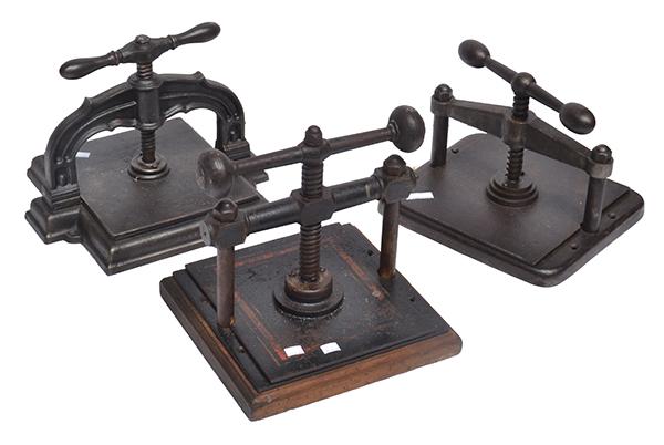 Appraisal: THREE CAST IRON BOOK PRESSES WITH WOODEN BASES LARGEST HEIGHT