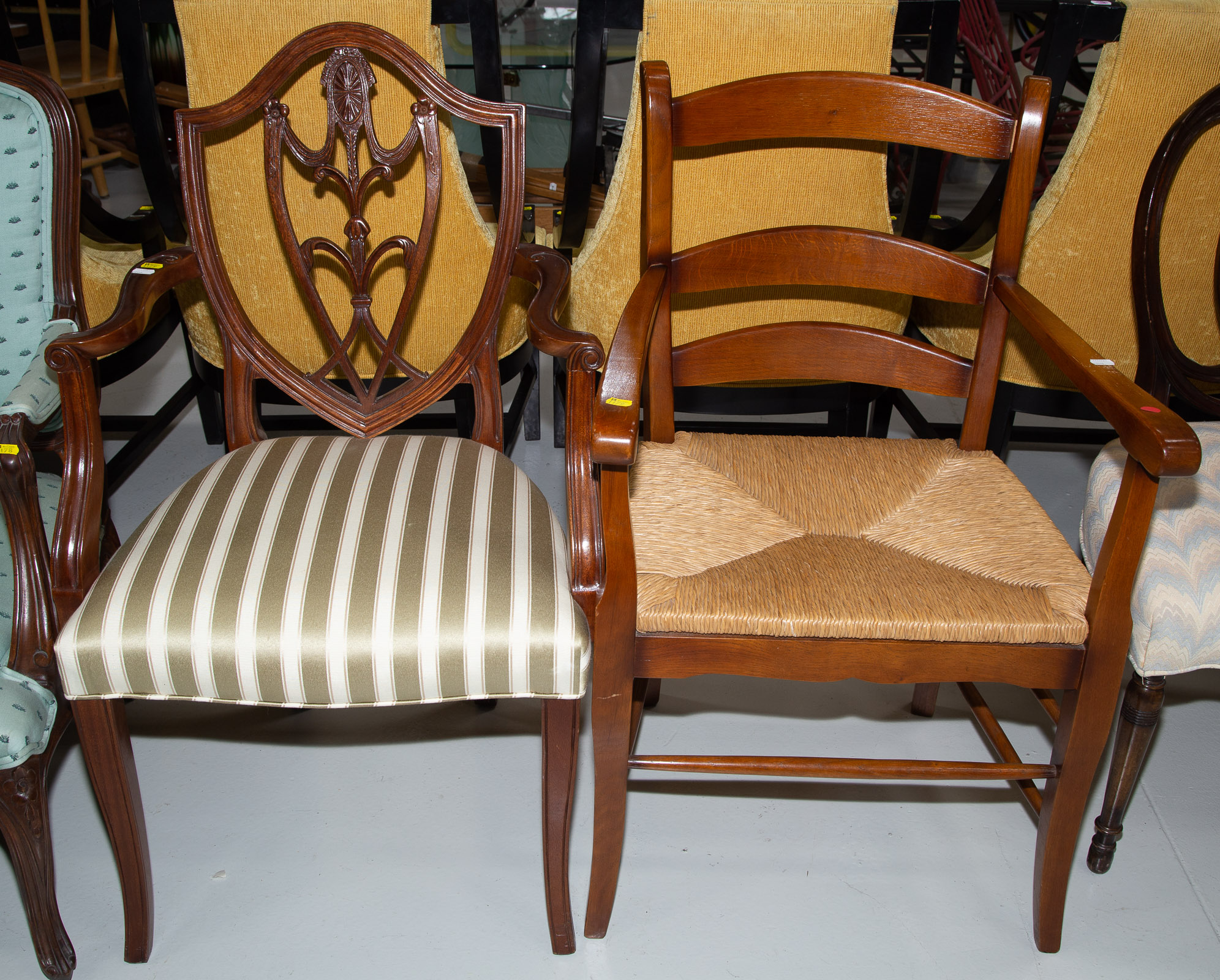 Appraisal: TWO ARM CHAIRS Including a vernacular style hickory ladder back