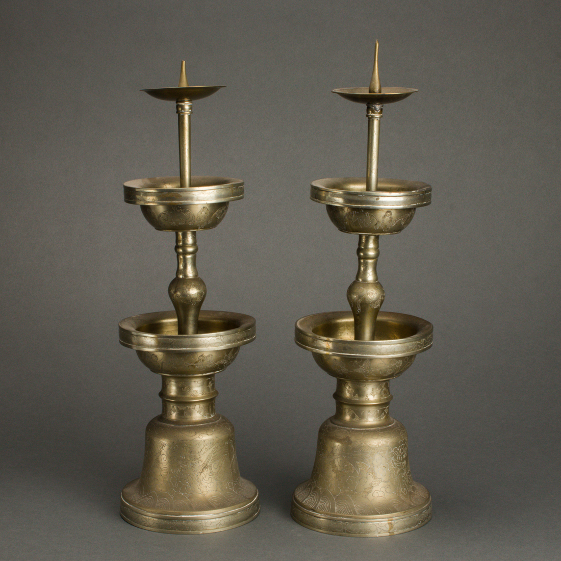 Appraisal: PAIR OF BRONZE CANDLESTICK HOLDERS Pair of bronze candlestick holders