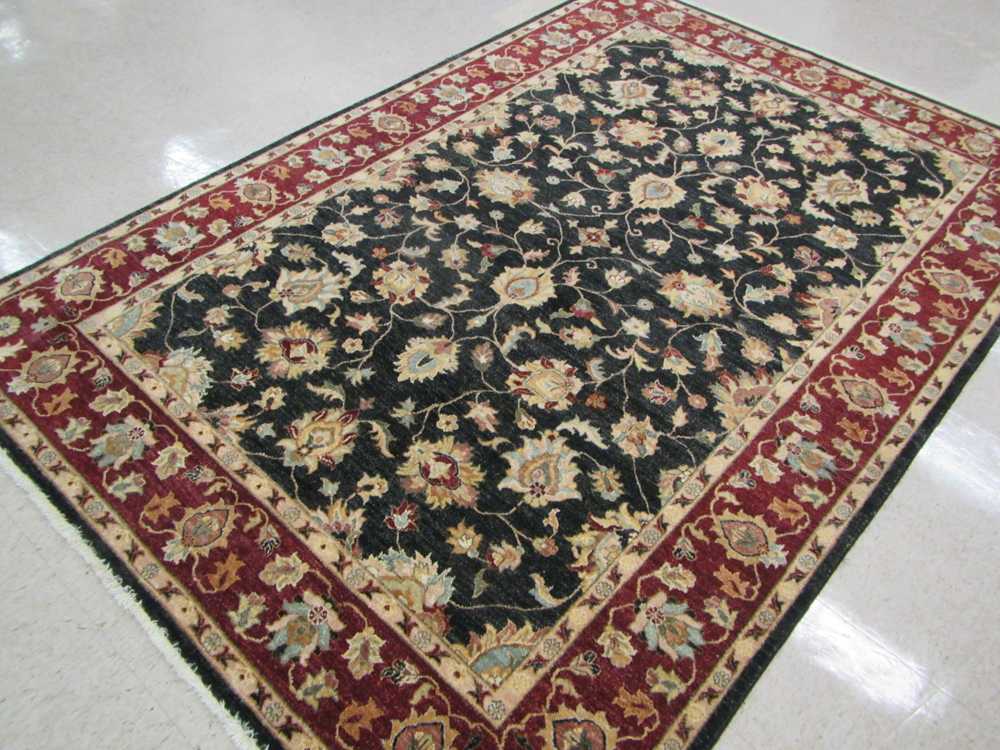 Appraisal: HAND KNOTTED ORIENTAL CARPET Pakistani Persian overall scrolling floral raceme