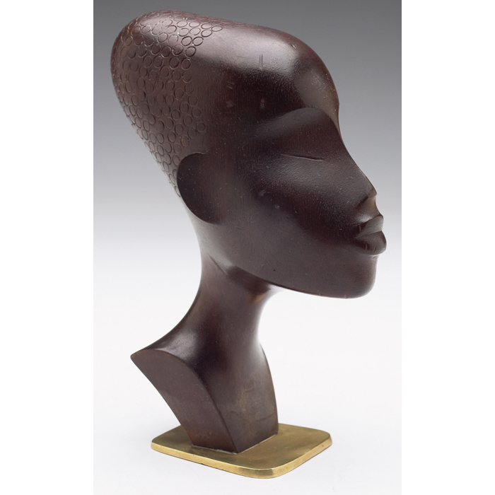 Appraisal: Hagenauer sculpture African head in wood mounted on a brass