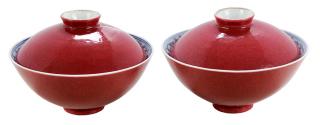 Appraisal: Pair of Ruby Enameled Porcelain Tea Bowls With Covers Chinese