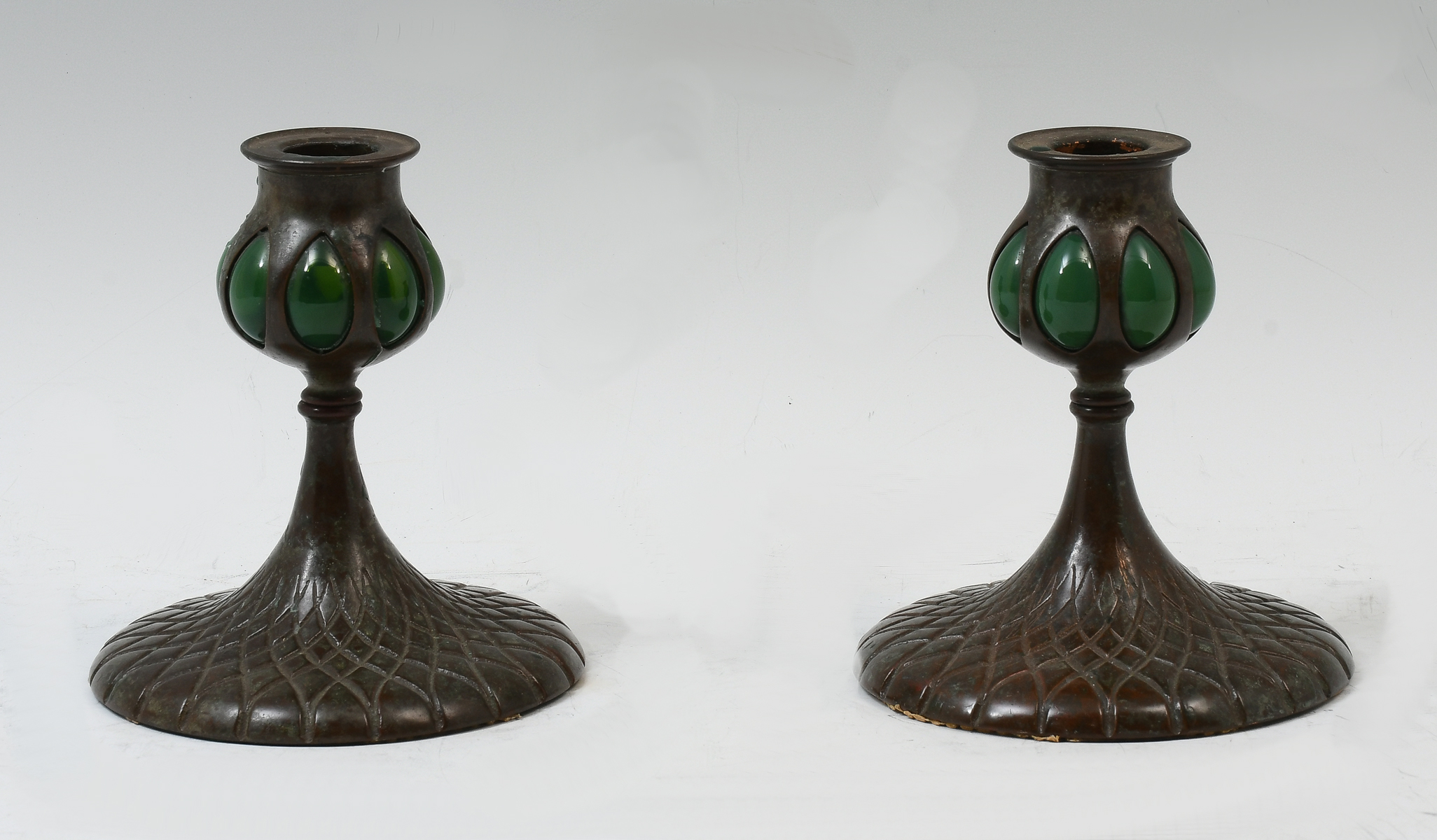 Appraisal: BUFFALO STUDIOS ART METAL CANDLESTICKS Tiffany style bronze candlesticks having