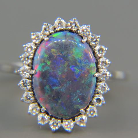 Appraisal: Black Opal Diamond Ring fiery oval carat opal surrounded by