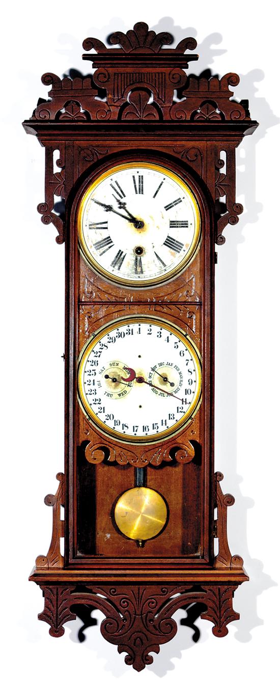 Appraisal: E N Welch Damrosch calendar clock circa walnut case with