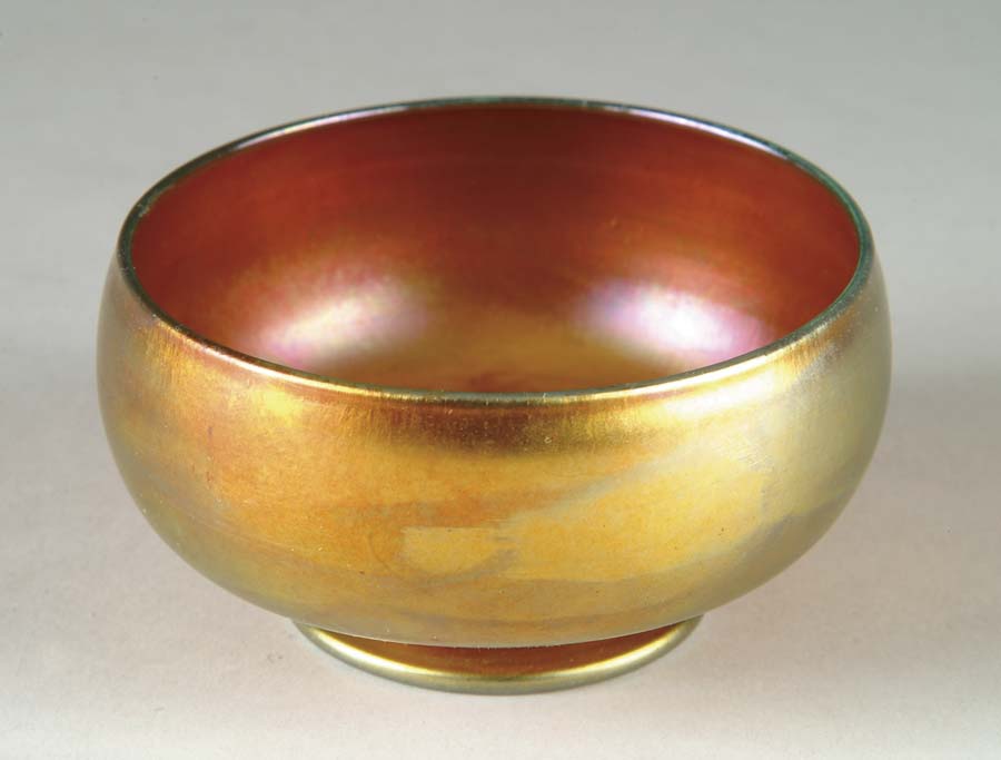 Appraisal: TIFFANY GOLD BOWL Simple gold favrile bowl features purple highlights