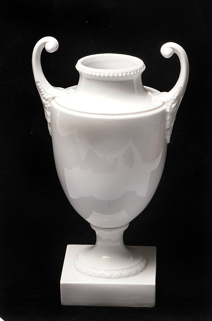 Appraisal: FURSTENBERG WHITE CERAMIC TWO HANDLED VASE of classical urn form