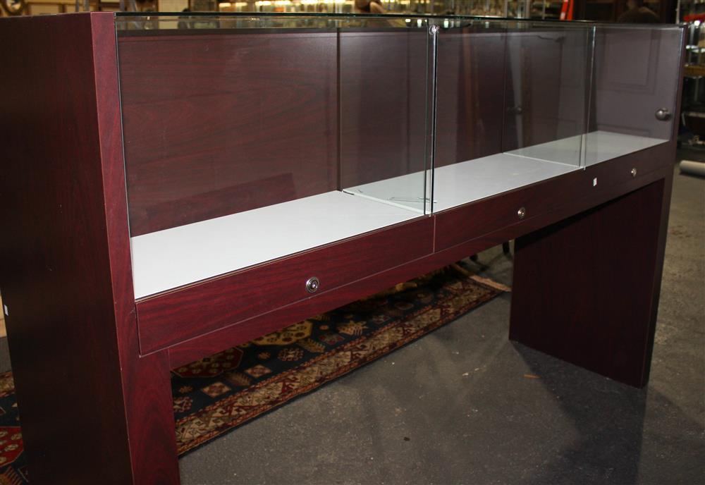 Appraisal: SLEEK CONTEMPORARY GLASS AND MAHOGANY STAINED VENEER TRIPLE DISPLAY CABINET