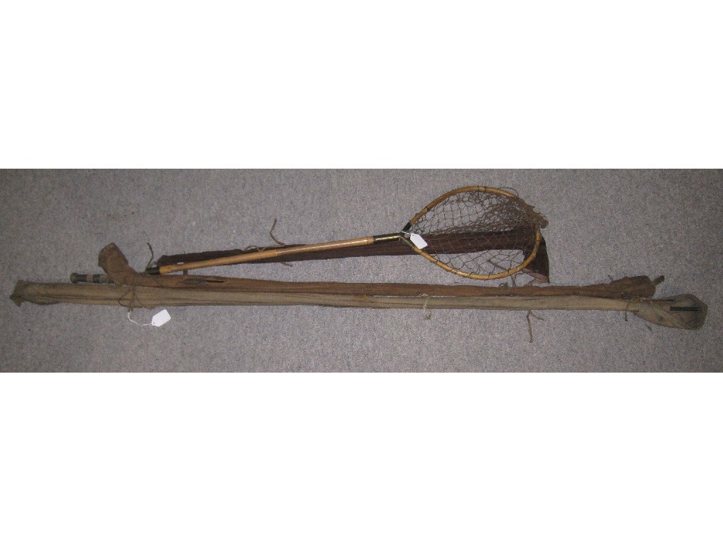 Appraisal: Lot comprising three fishing rods and a net