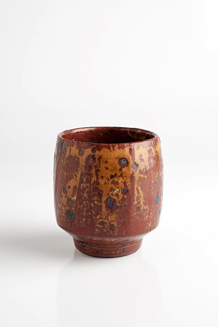 Appraisal: Henry Hammond British - Tea cupmottled iron oxide glazeimpressed potter's