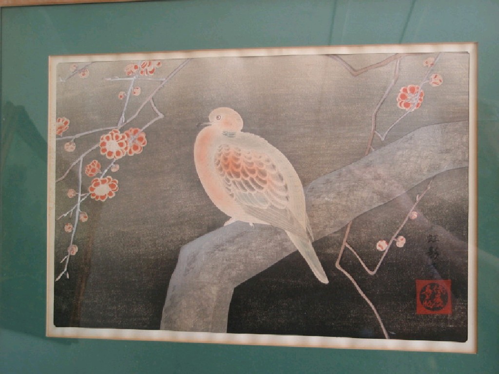 Appraisal: A Japanese hand coloured print of a bird on a