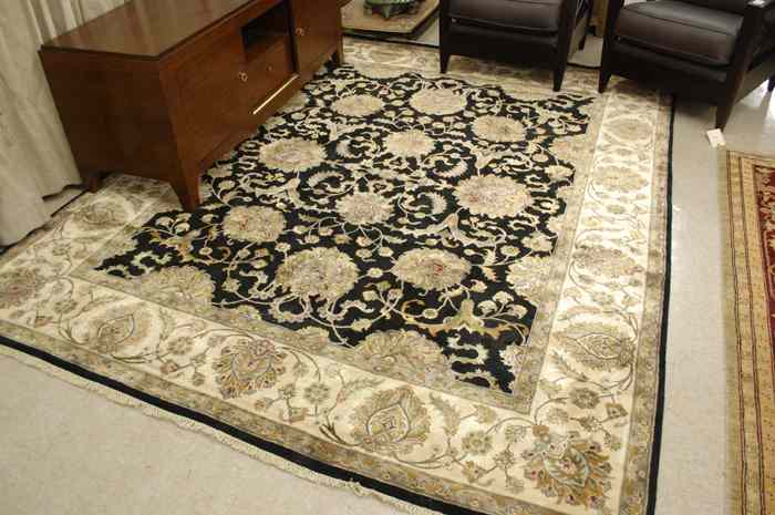 Appraisal: FINE HAND KNOTTED ORIENTAL CARPET Indo-Persian overall floral design on