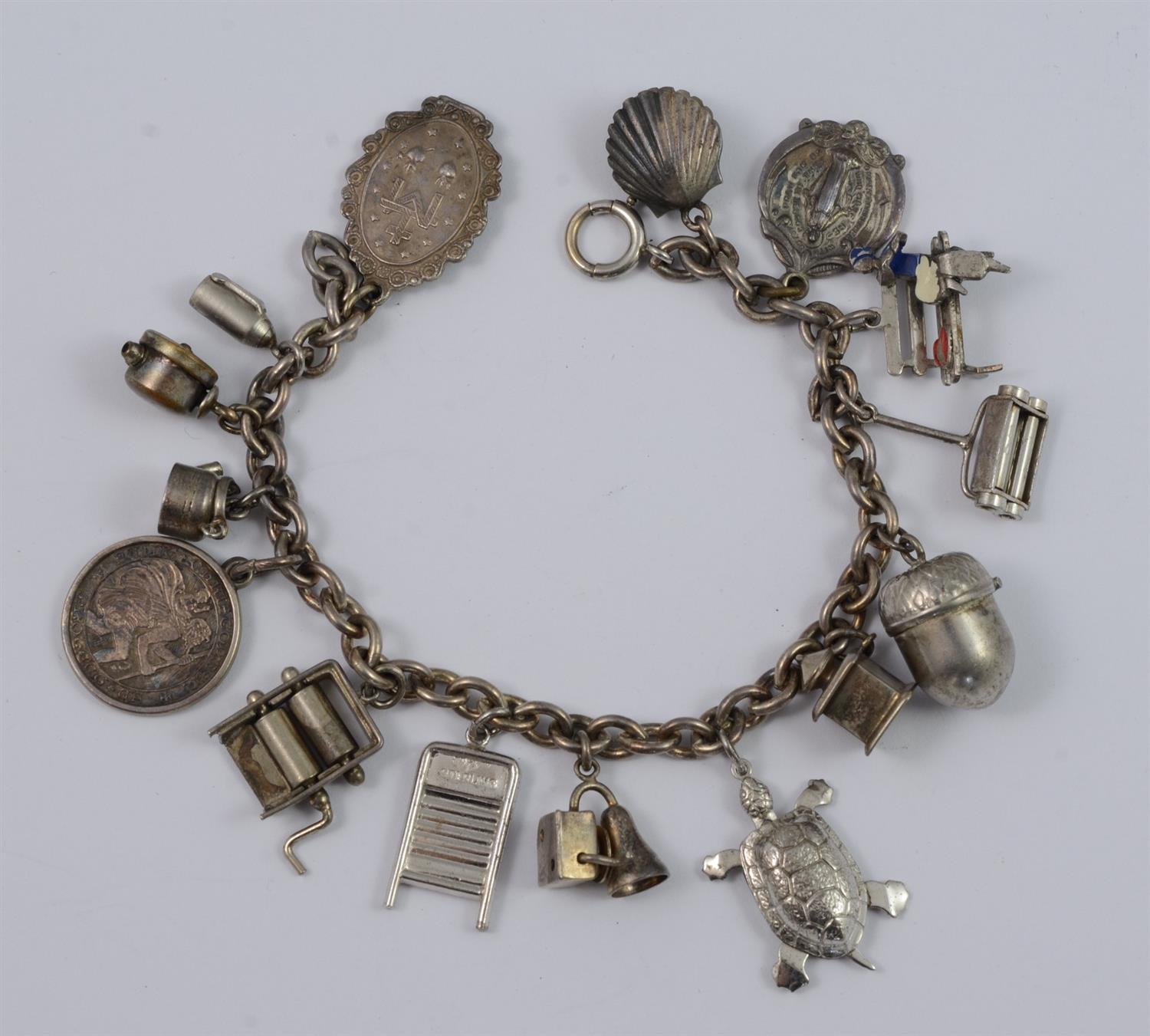 Appraisal: Sterling silver charm bracelet charms some unmarked TO