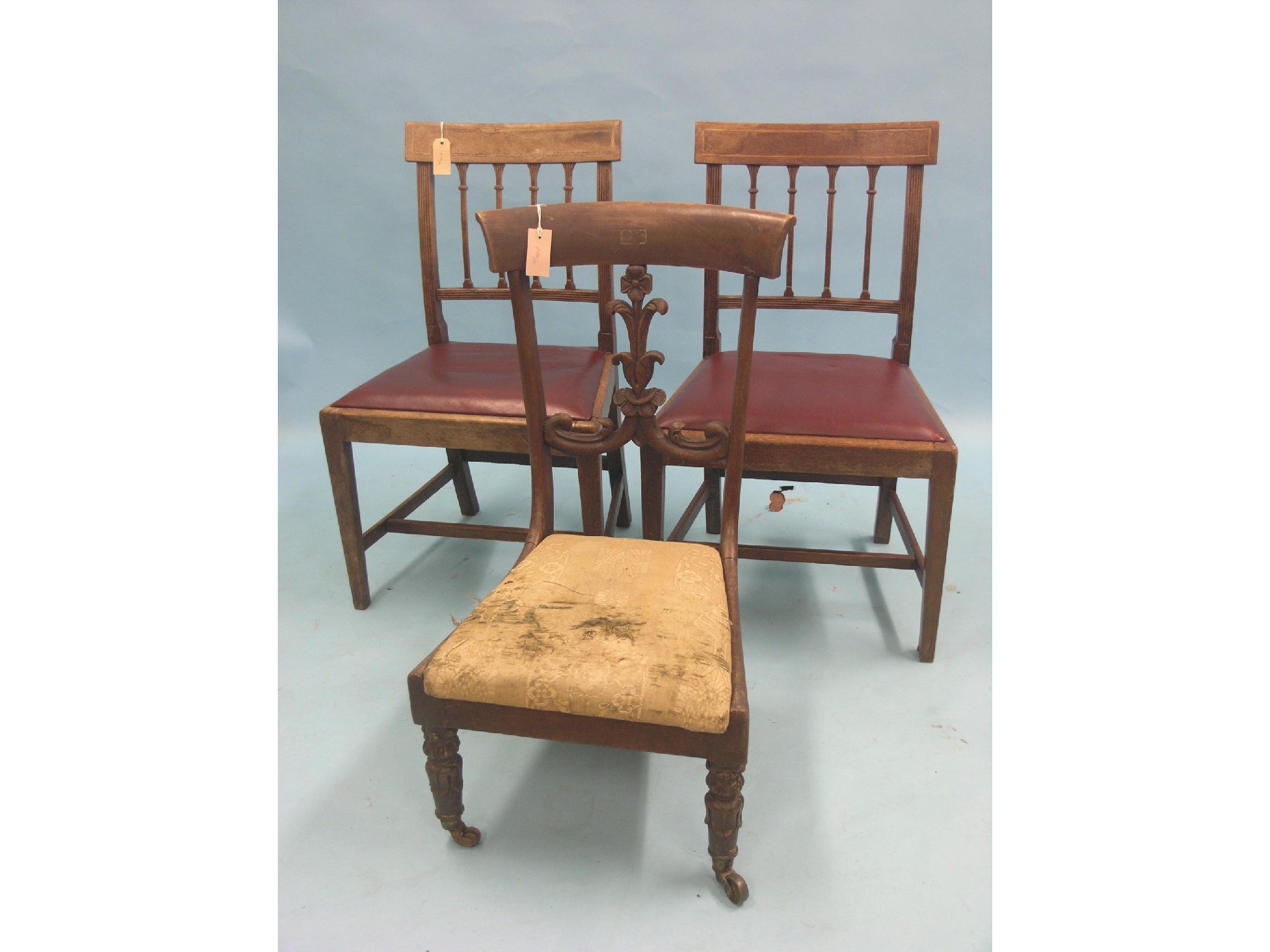 Appraisal: An early Victorian mahogany nursing chair with carved leaf-scroll back