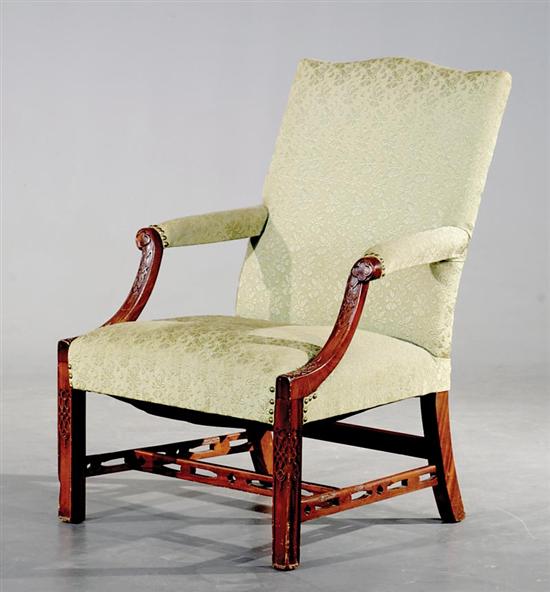 Appraisal: Chinese Chippendale style mahogany library chair th century serpentine padded