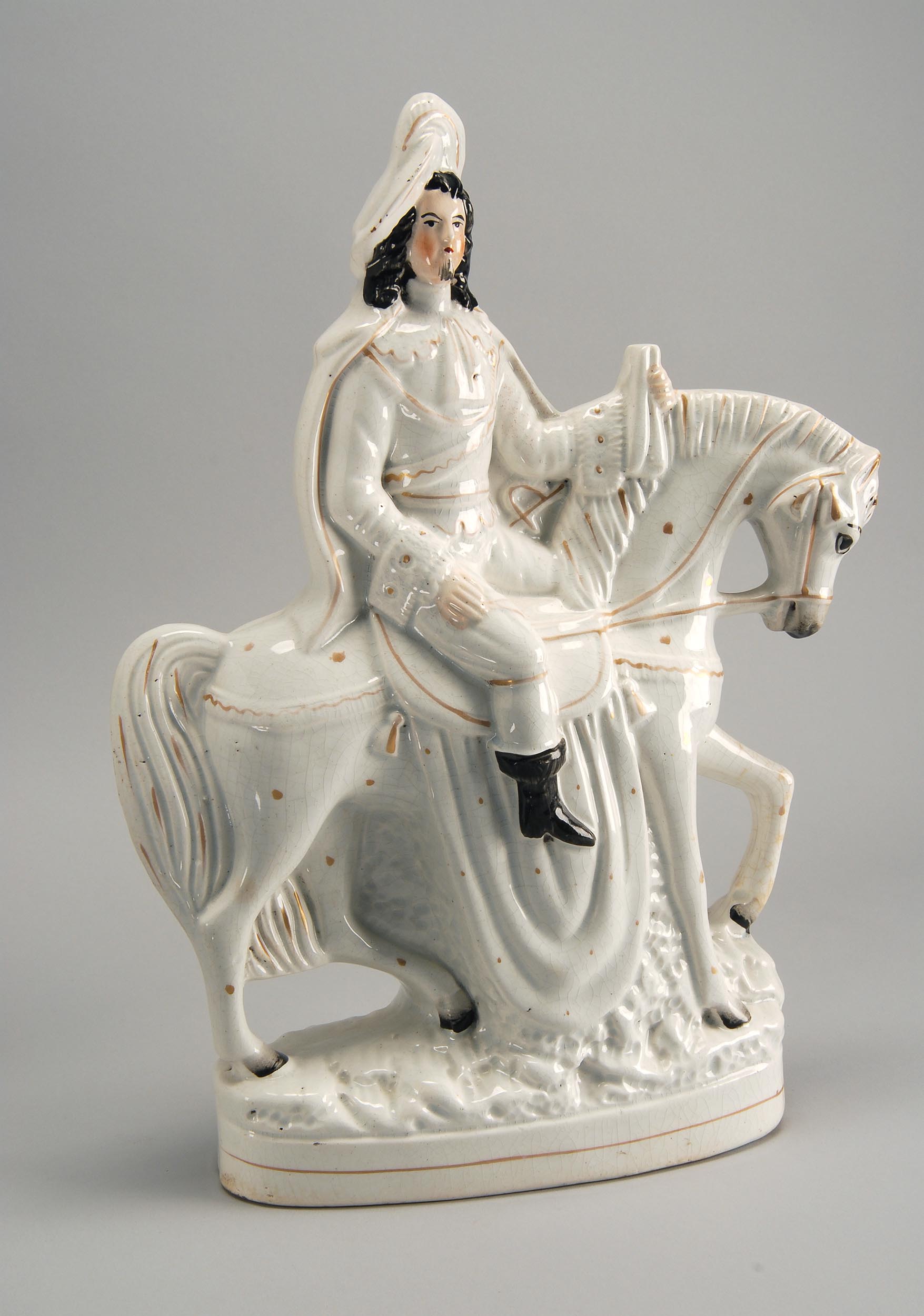 Appraisal: TH CENTURY STAFFORDSHIRE FIGURE GROUP of a cavalier on horseback