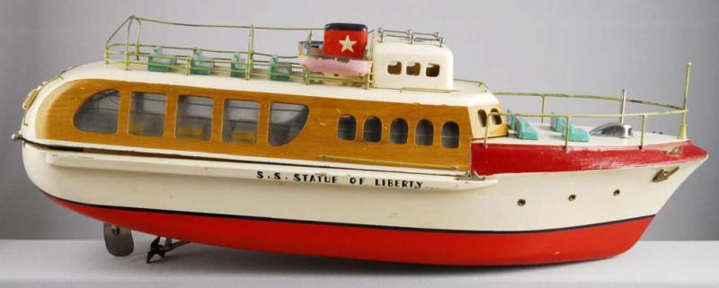 Appraisal: Japanes Battery-Operated Wooden Boat Toy Description S S Statue of