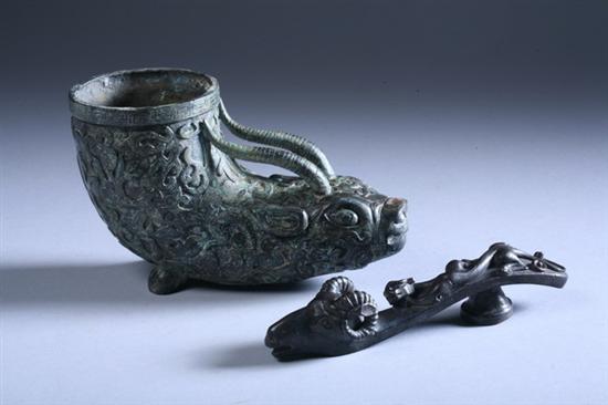 Appraisal: CHINESE MYTHICAL ANIMAL-FORM CUP Together with ram head-form belt buckle