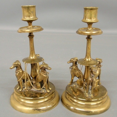 Appraisal: - Pair of brass candlesticks c decorated with seated whippets