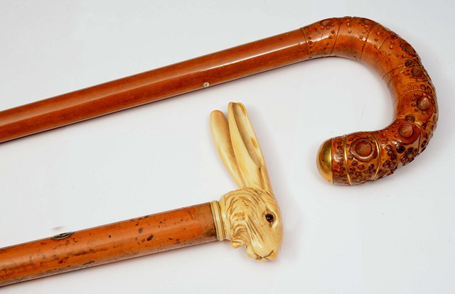 Appraisal: A MALACCA CANE of tapering form with carved ivory rabbits