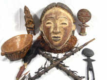 Appraisal: Ten tribal artefacts including masks carvings etc