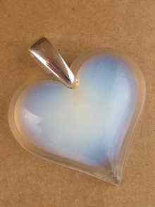 Appraisal: A Lalique heart shaped pendant with silver suspension loop approx