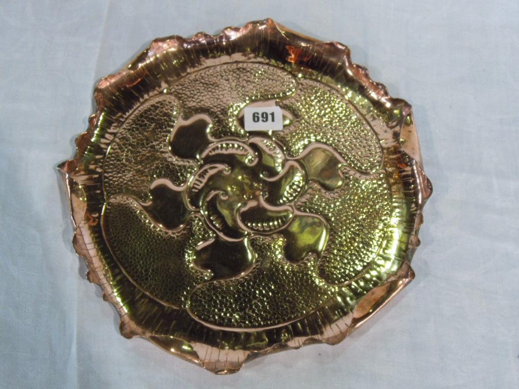 Appraisal: A Newlyn style copper beaten tray with folded scalloped edge