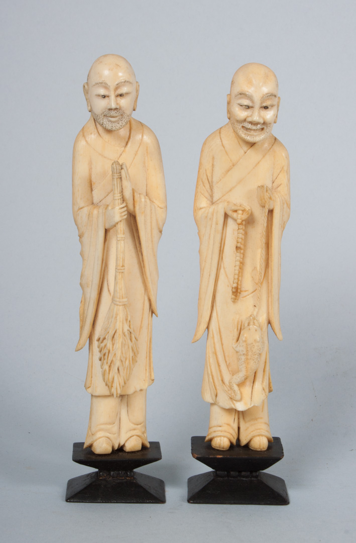 Appraisal: Two Japanese carved ivory sages one holding whisk broom other