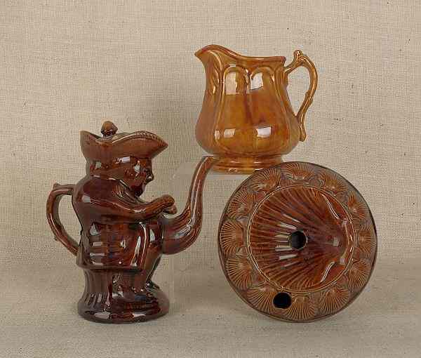 Appraisal: Three Rockingham glaze pottery pieces th c to include a