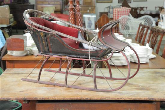 Appraisal: CHILD'S SLEIGH Stencil decorated original maroon upholstery iron and wood