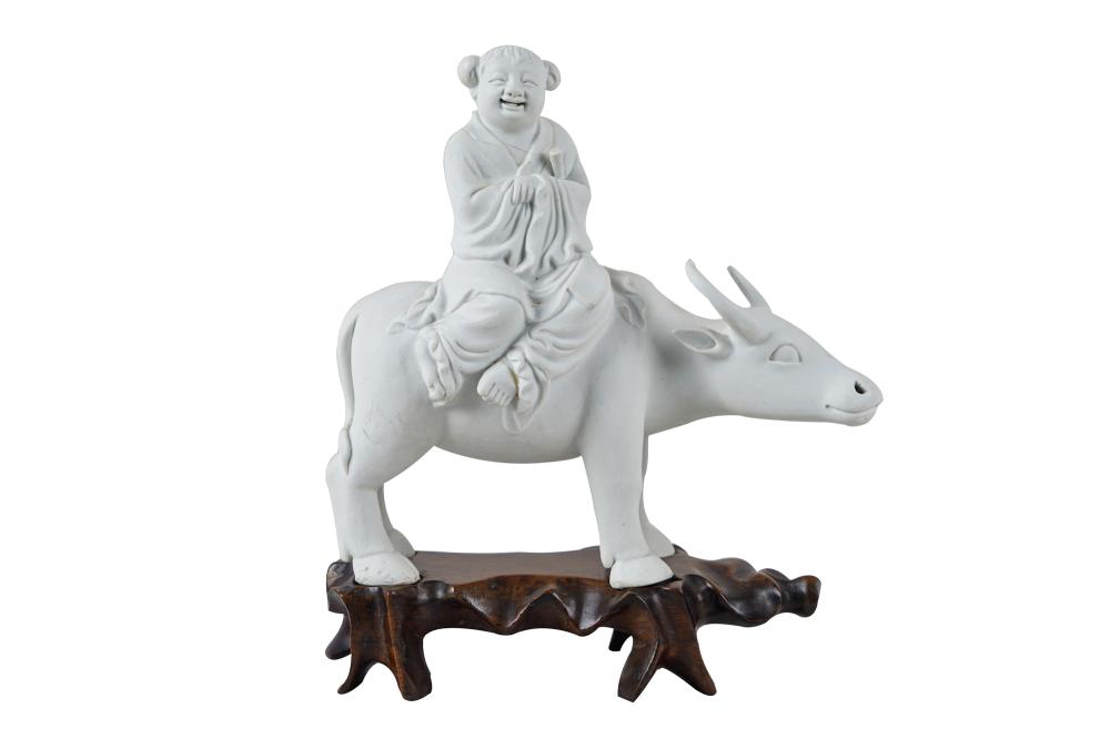 Appraisal: CHINESE BISQUE PORCELAIN WATER BUFFALOresting on a fitted wood base