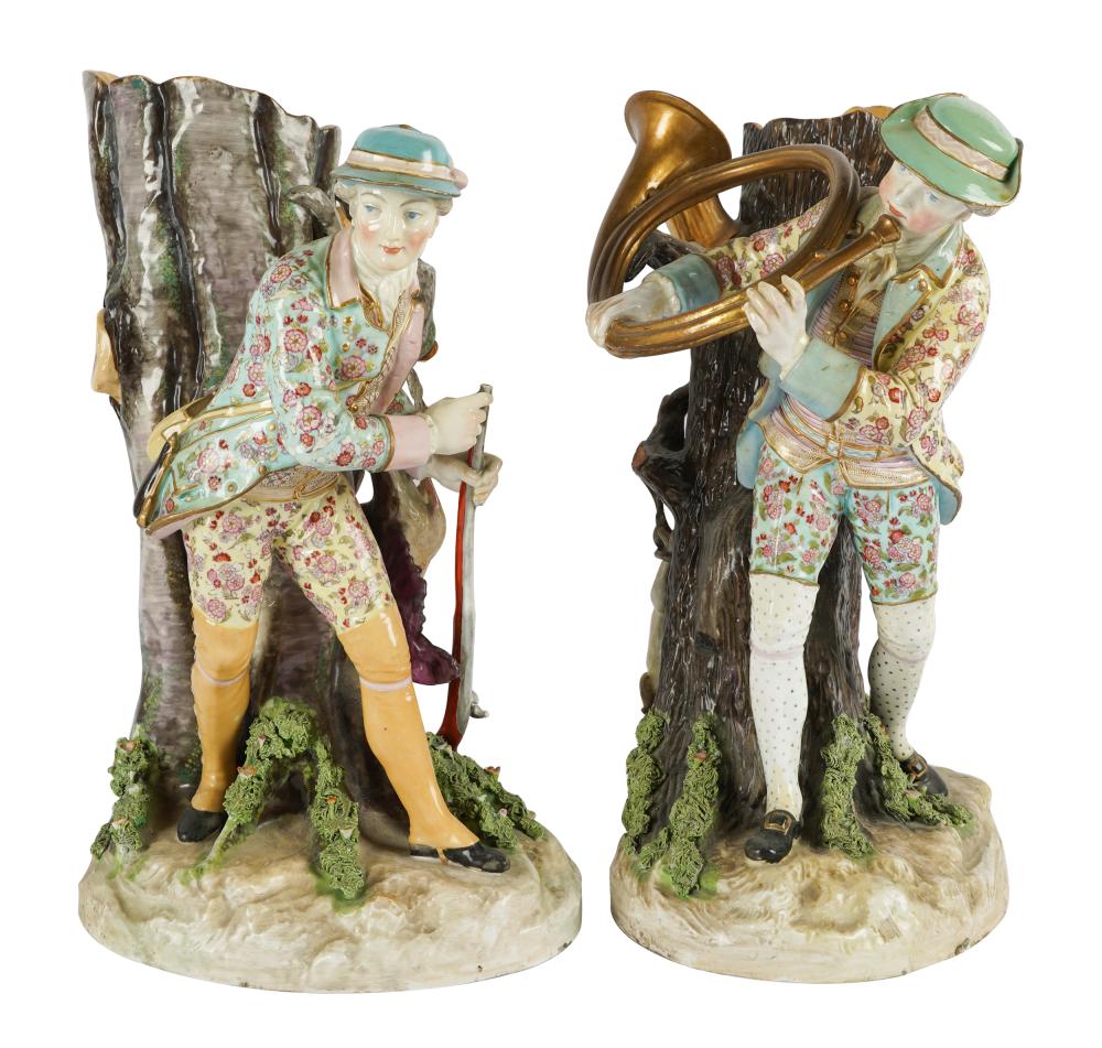 Appraisal: PAIR OF CONTINENTAL PORCELAIN FIGURAL SPILL VASESunmarked modeled as huntsmen