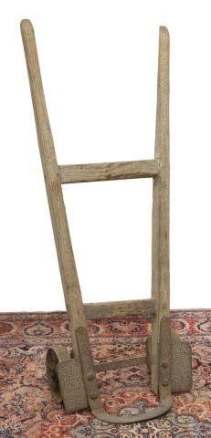 Appraisal: Primitive pine hand truck late th early th c with