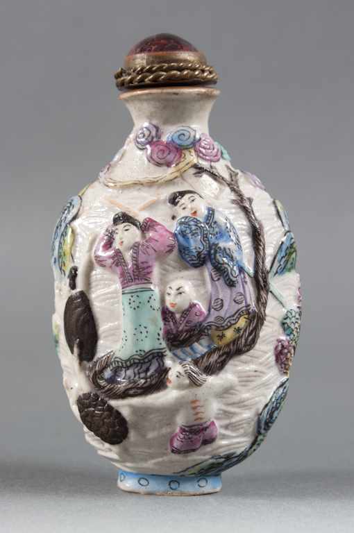 Appraisal: Chinese Famille Rose relief decorated porcelain snuff bottle one side