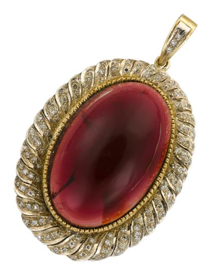 Appraisal: Platinum topped karat yellow gold cabochon garnet and diamond pendant