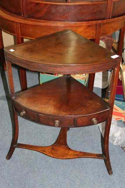 Appraisal: A GEORGE III MAHOGANY TWO TIER CORNER WASH STAND with