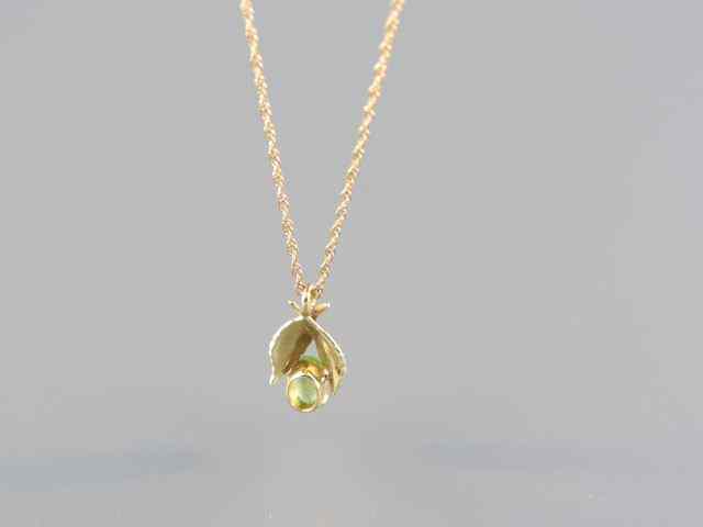 Appraisal: Peridot Pendant vivid pear shape gem k yellow gold including