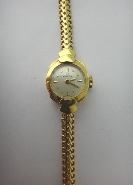 Appraisal: A lady's ct gold shaped circular cased Omega wristwatch the