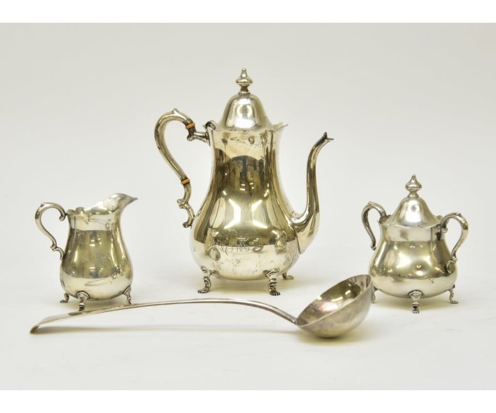 Appraisal: Sterling silver three-piece tea service tallest h together with a