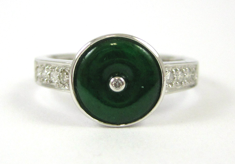 Appraisal: JADE AND FOURTEEN KARAT WHITE GOLD RING featuring a round