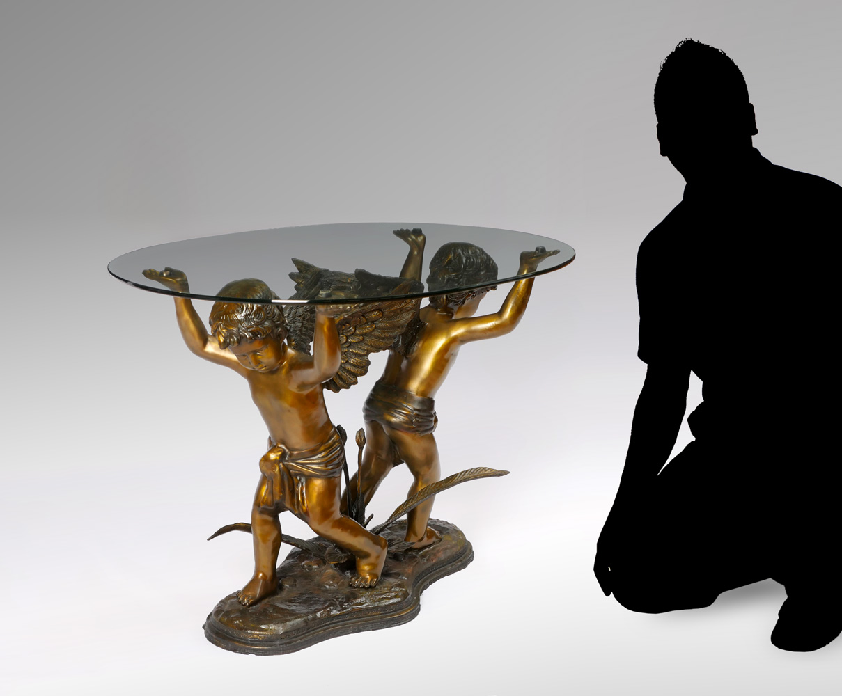 Appraisal: GLASS TOP BRONZE TABLE OF CHERUBS First quarter th century