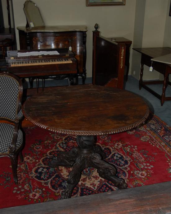 Appraisal: A th C Mahogany Tilt-top Table round with a gadrooned