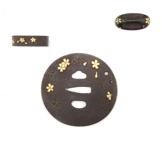 Appraisal: An Iron Fuchi-Kurikata and Tsuba Set having gilt and incised