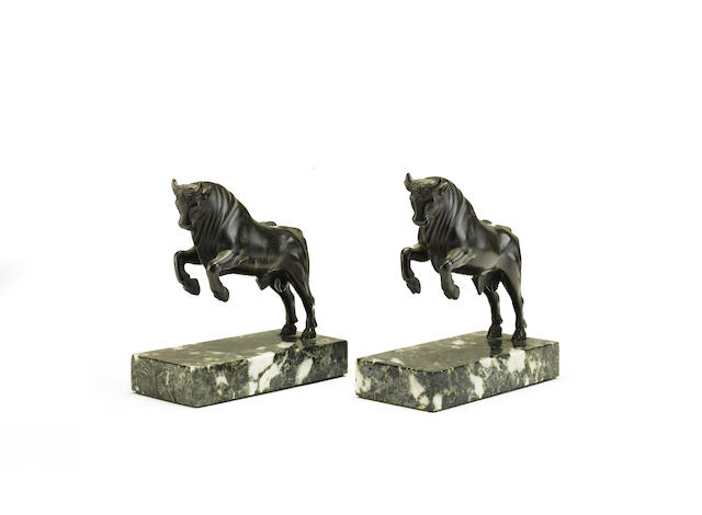 Appraisal: A pair of th century bronze models of rearing bulls