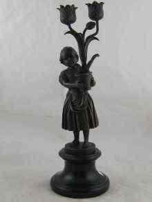 Appraisal: After A Becqueroli A bronze two branch candelabra designed as