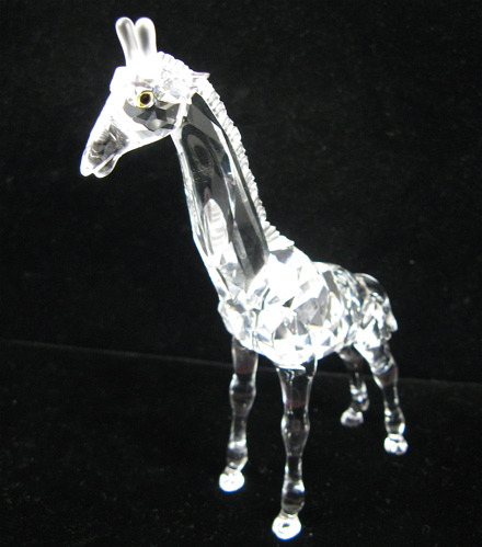 Appraisal: SWAROVSKI AUSTRIAN CUT CRYSTAL BABY GIRAFFE with green eyes faceted