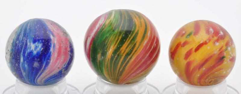 Appraisal: Lot of Onionskin Marbles Description Includes two four-paneled onionskins and