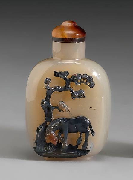 Appraisal: A carved Suzhou agate snuff bottle The rectangular-shaped bottle with